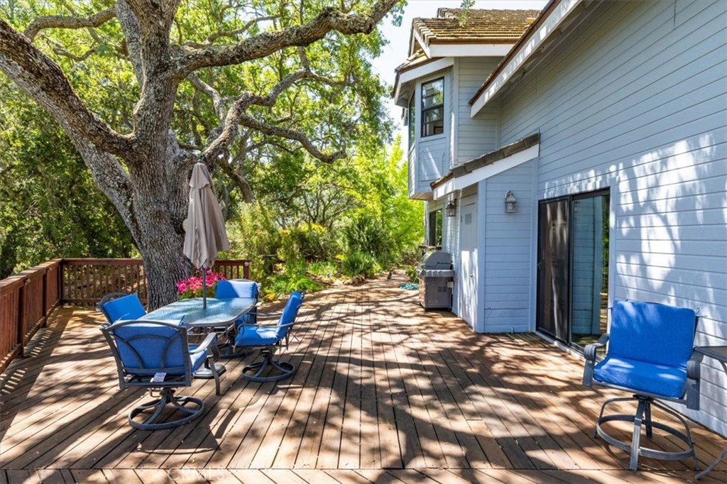 12355 Santa Ana Road Atascadero, CA 93422 - Photo 49 of 57 a view of a backyard with table and chairs and a barbeque