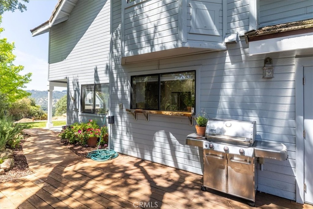 12355 Santa Ana Road Atascadero, CA 93422 - Photo 53 of 57 a kitchen with granite countertop stove top oven and potted plant