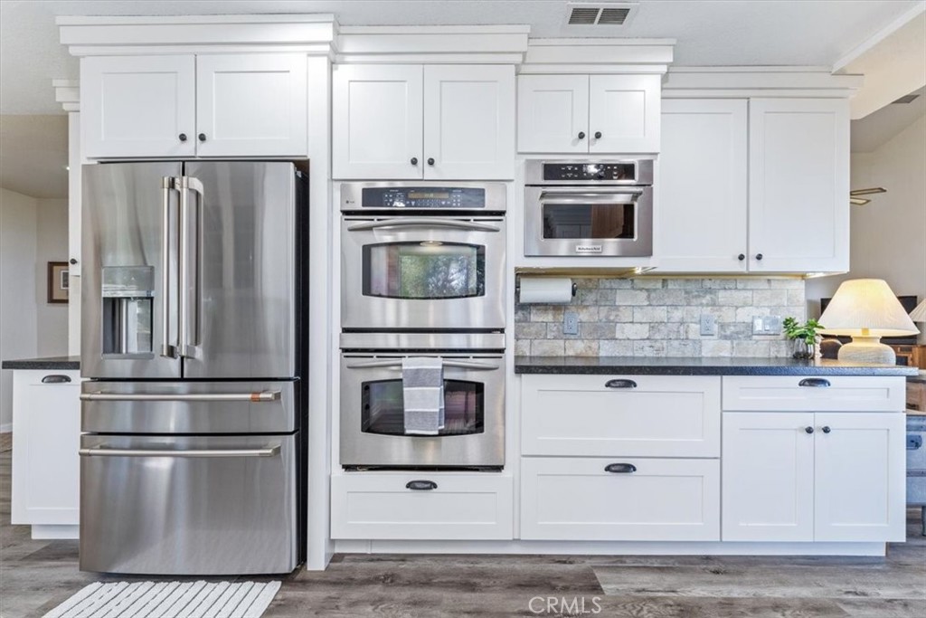 12355 Santa Ana Road Atascadero, CA 93422 - Photo 6 of 57 a kitchen with cabinets stainless steel appliances and counter space