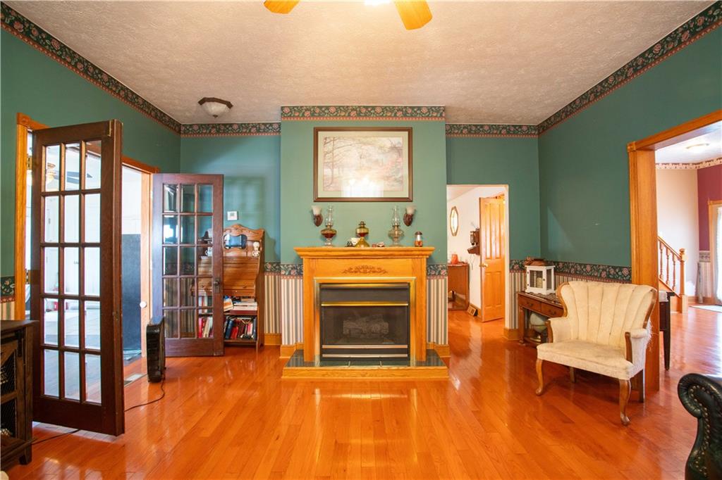166 Pennsylvania Avenue Rochester, PA 15074 - Photo 7 of 30 a living room with furniture and a fireplace