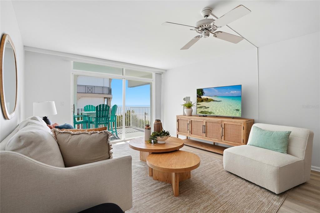 16308 Gulf Boulevard, Unit 303 Redington Beach, FL 33708 - Photo 13 of 42 a living room with furniture and a large window