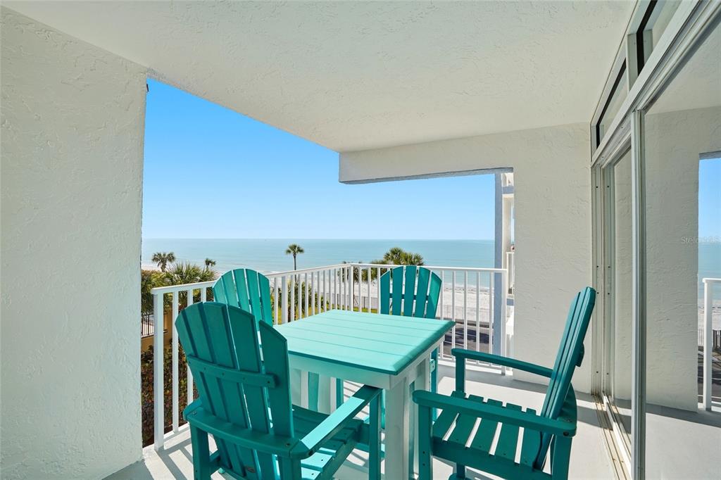 16308 Gulf Boulevard, Unit 303 Redington Beach, FL 33708 - Photo 19 of 42 a view of a dining room with furniture and wooden floor