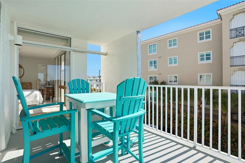 16308 Gulf Boulevard, Unit 303 Redington Beach, FL 33708 - Photo 21 of 42 a view of a chairs and table in the balcony