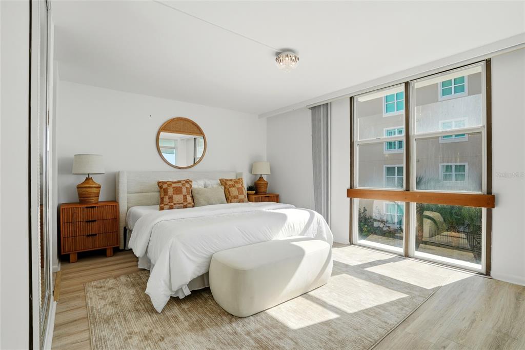 16308 Gulf Boulevard, Unit 303 Redington Beach, FL 33708 - Photo 24 of 42 a bed room with a bed and a window