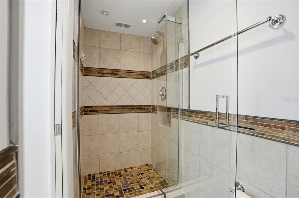 16308 Gulf Boulevard, Unit 303 Redington Beach, FL 33708 - Photo 28 of 42 a bathroom with a shower and a shower