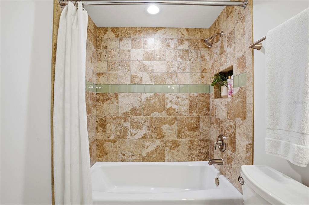16308 Gulf Boulevard, Unit 303 Redington Beach, FL 33708 - Photo 34 of 42 a bathroom with a bathtub and shower