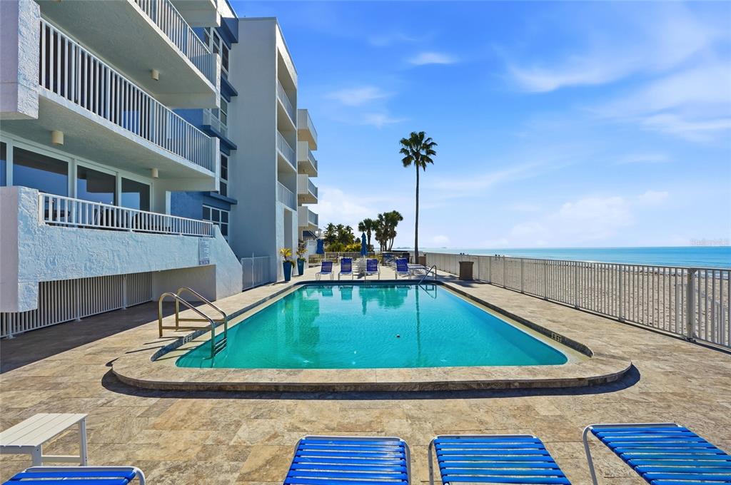 16308 Gulf Boulevard, Unit 303 Redington Beach, FL 33708 - Photo 37 of 42 a view of swimming pool with a yard