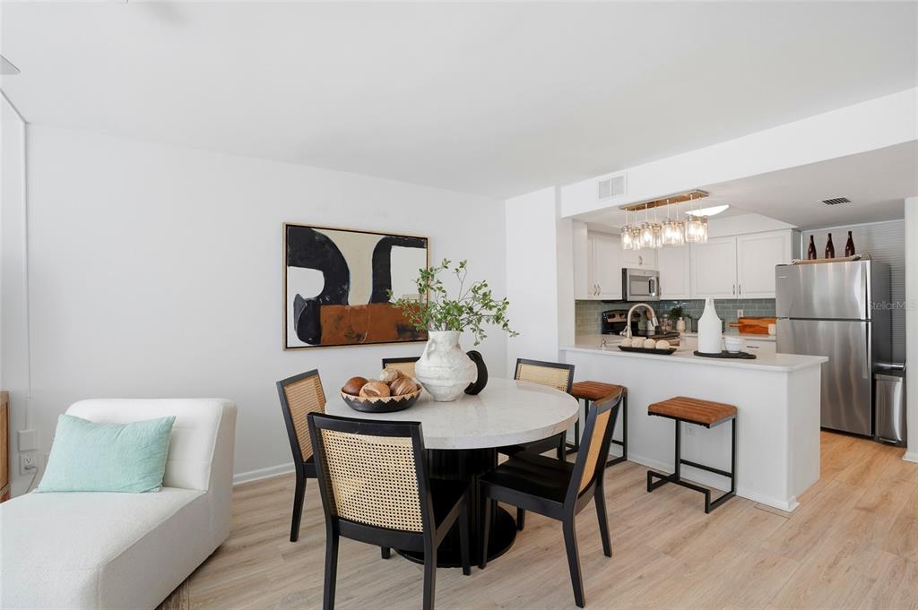 16308 Gulf Boulevard, Unit 303 Redington Beach, FL 33708 - Photo 9 of 42 a dining room with furniture and window