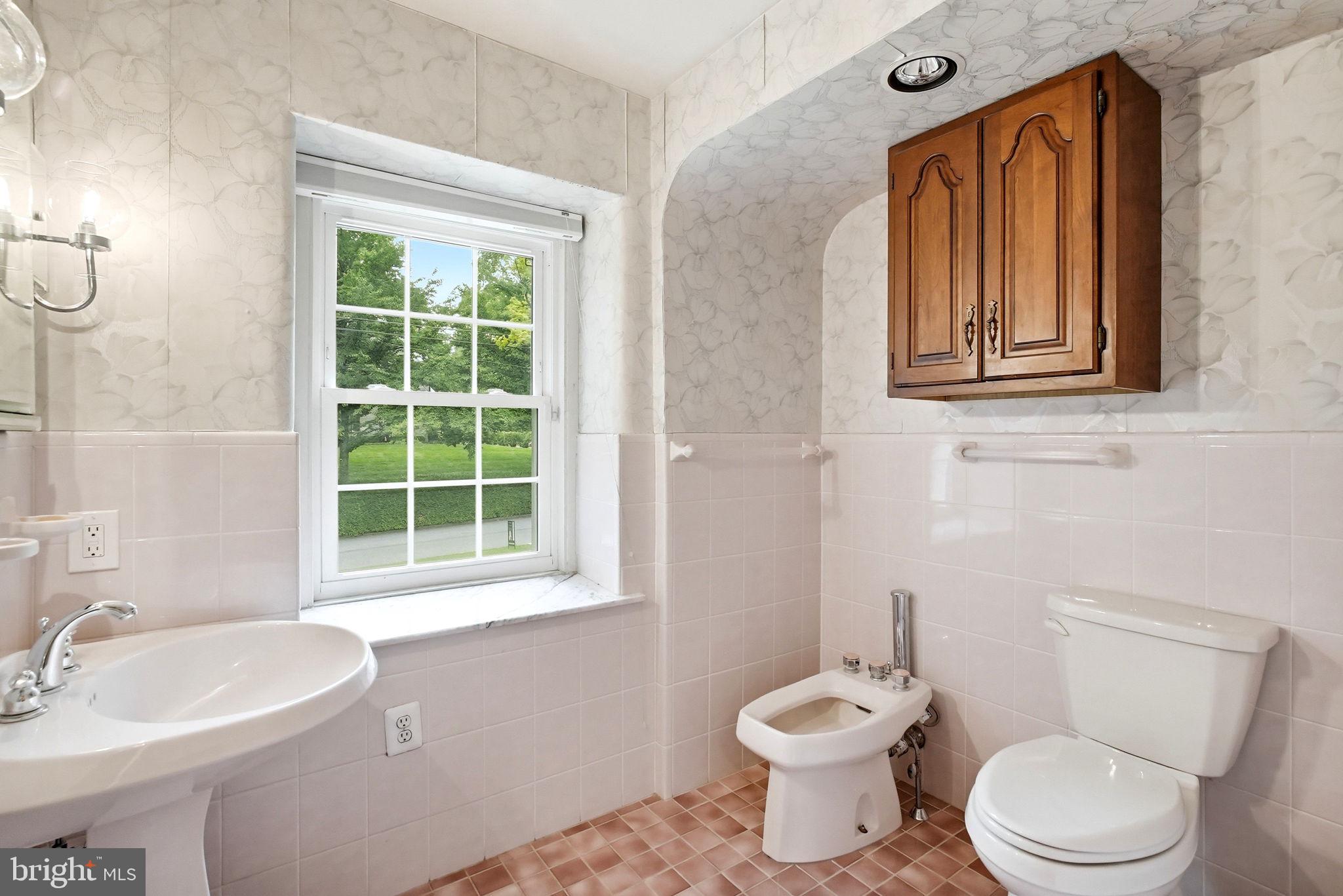 419 Riverview Road Swarthmore, PA 19081 - Photo 28 of 70 a bathroom with a toilet a sink and a window