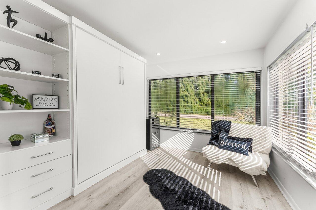 5300 Nesting Way, Unit A Delray Beach, FL 33484 - Photo 13 of 53 a living room with furniture and a large window