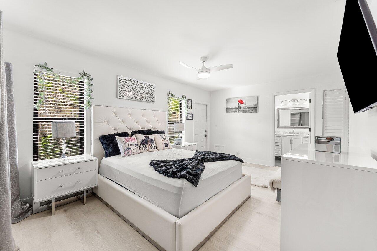 5300 Nesting Way, Unit A Delray Beach, FL 33484 - Photo 16 of 53 a living room with furniture and a flat screen tv