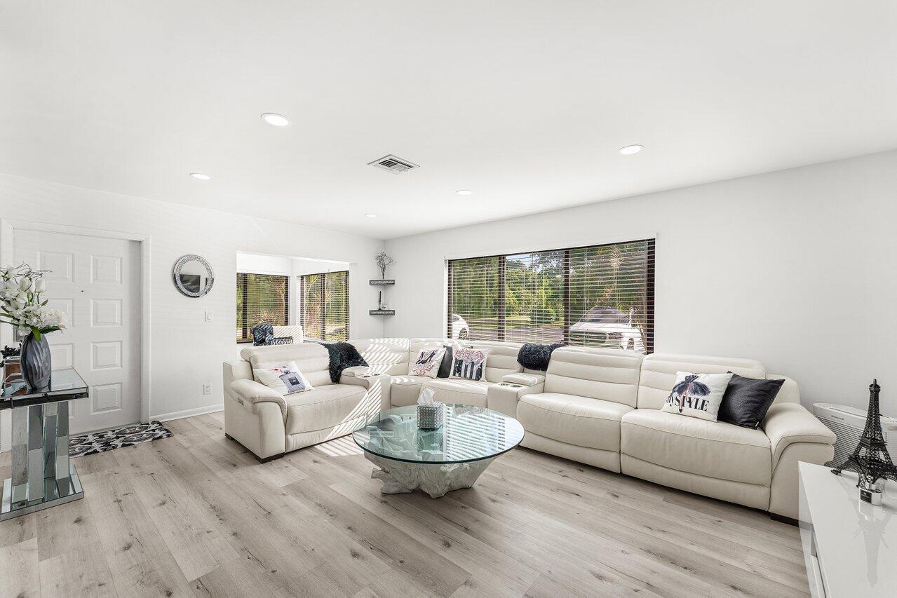 5300 Nesting Way, Unit A Delray Beach, FL 33484 - Photo 2 of 53 a living room with furniture and a large window