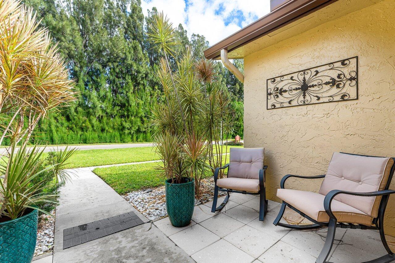5300 Nesting Way, Unit A Delray Beach, FL 33484 - Photo 28 of 53 a outdoor living space with furniture and garden