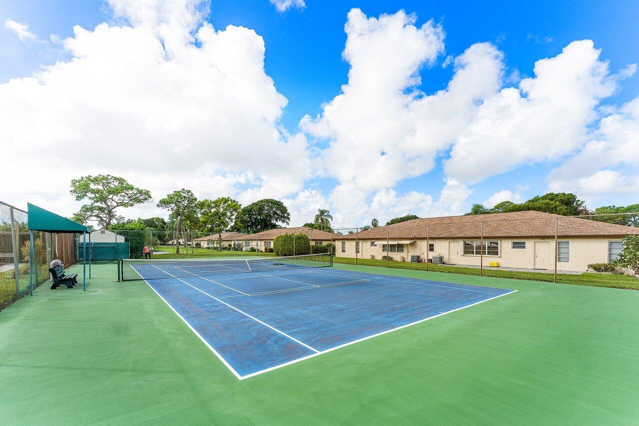 5300 Nesting Way, Unit A Delray Beach, FL 33484 - Photo 33 of 53 a view of an house with swimming pool garden and patio