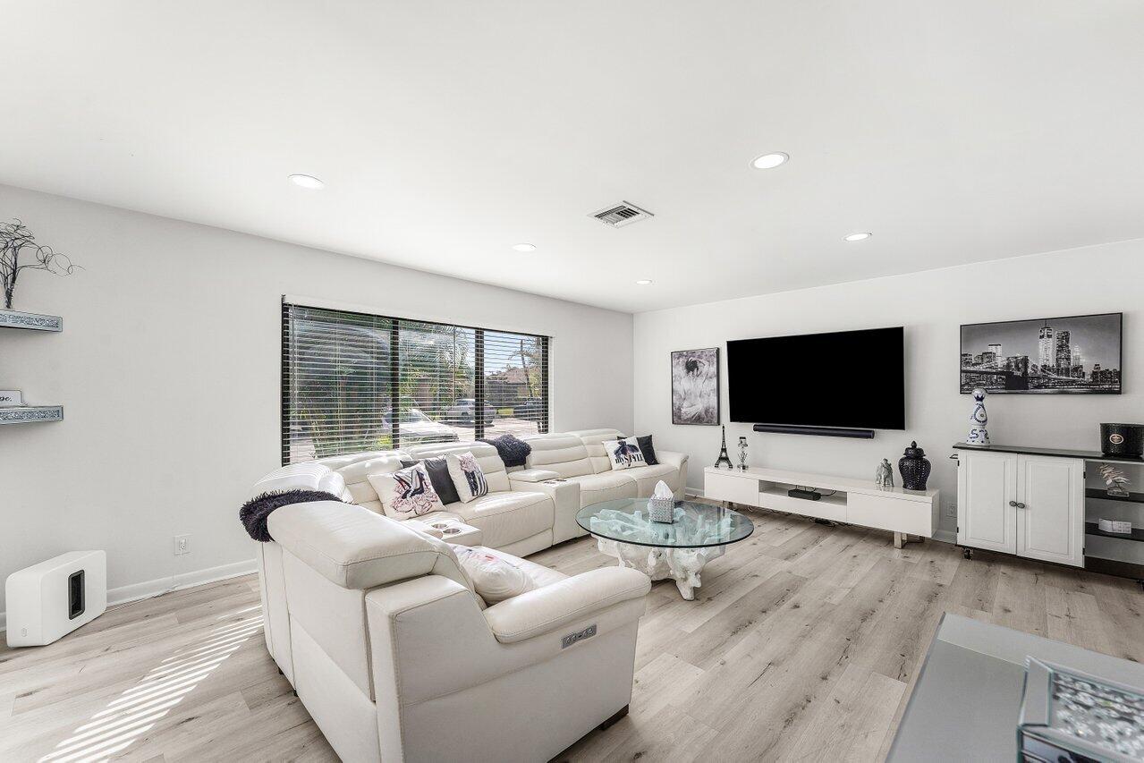 5300 Nesting Way, Unit A Delray Beach, FL 33484 - Photo 4 of 53 a living room with furniture and a flat screen tv