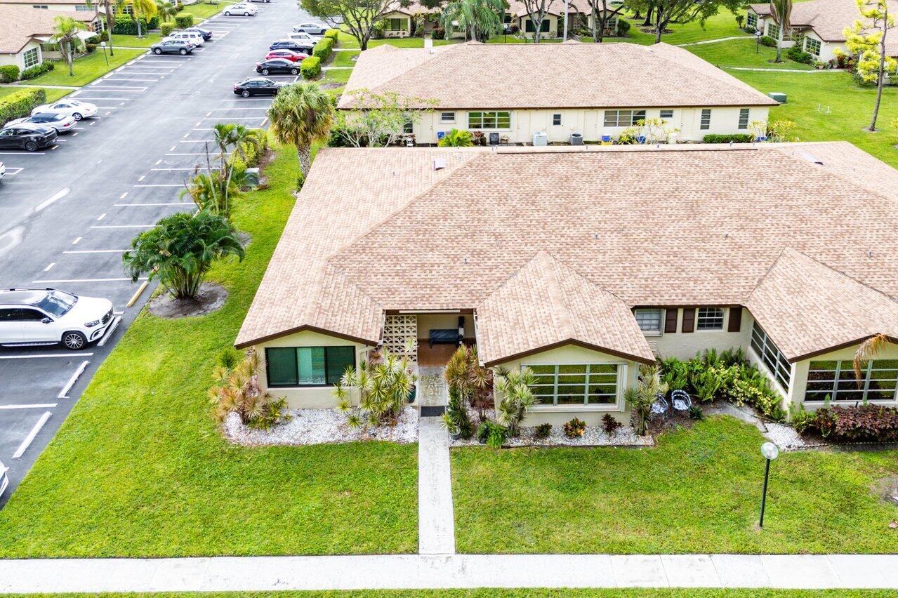 5300 Nesting Way, Unit A Delray Beach, FL 33484 - Photo 42 of 53 a aerial view of a house with a yard