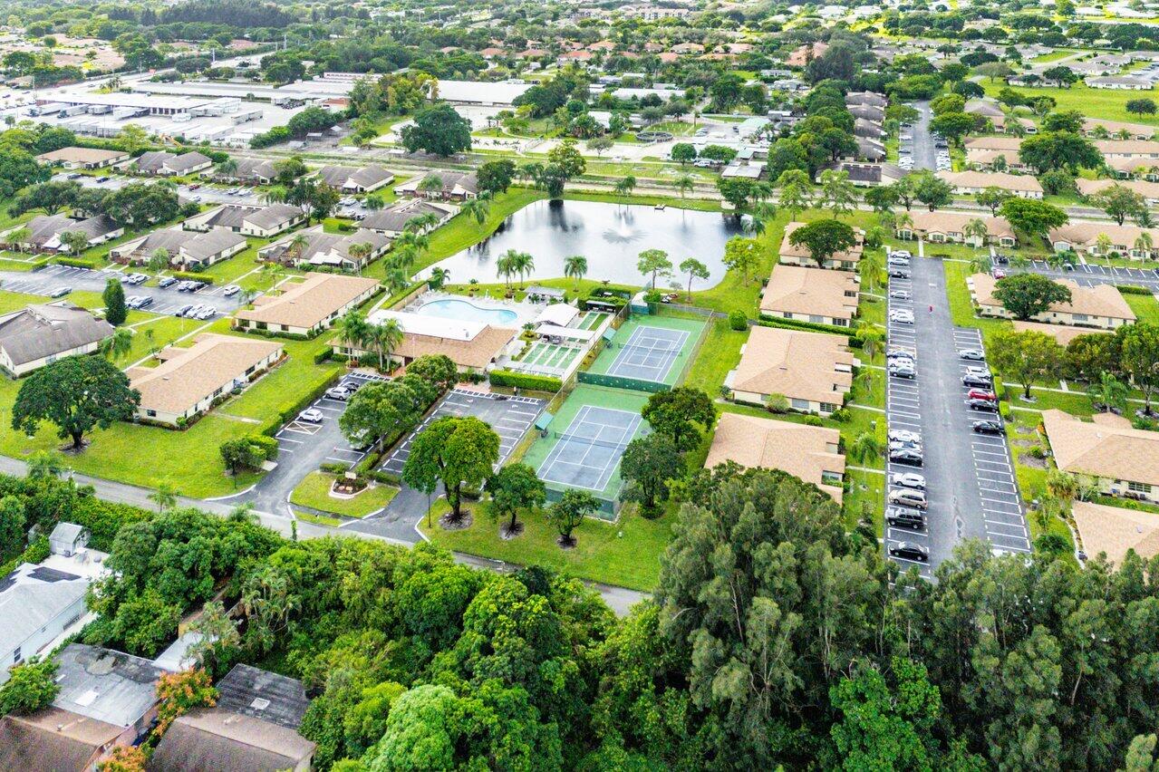 5300 Nesting Way, Unit A Delray Beach, FL 33484 - Photo 49 of 53 an aerial view of residential houses with outdoor space and trees all around