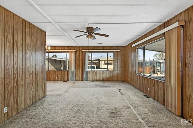 a view of a kitchen with kitchen island wooden floor and window