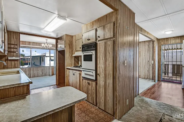 a view of a livingroom with a chandelier fan