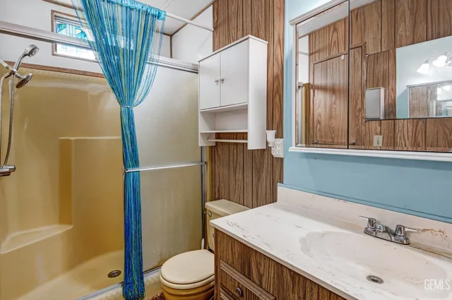 a view of an empty room with a kitchen