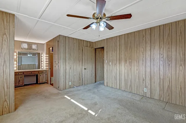 a bathroom with a shower a mirror and a sink
