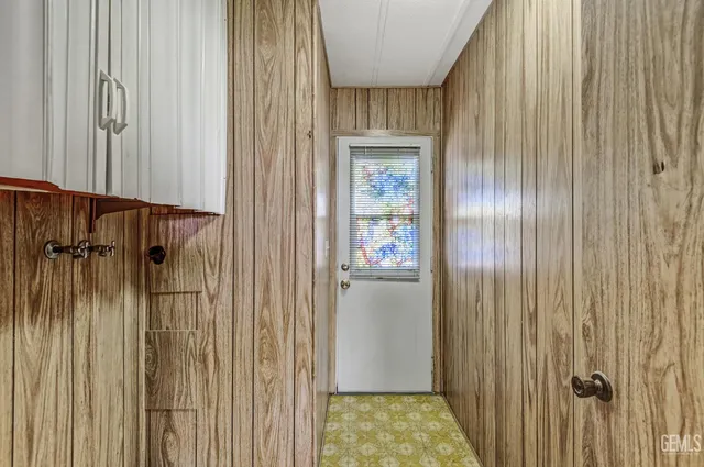 a view of pool with brick walls