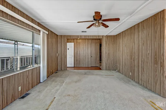 view of hall way with furniture and window