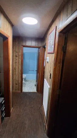 a view of entryway with wooden walls