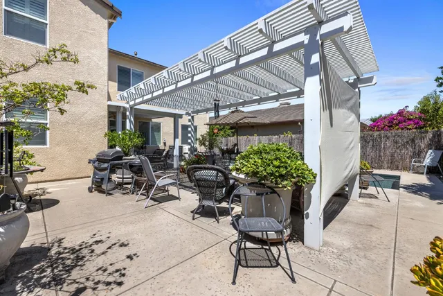 a view of a chairs and table in the patio