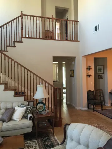 a view of entryway livingroom and hall with wooden floor