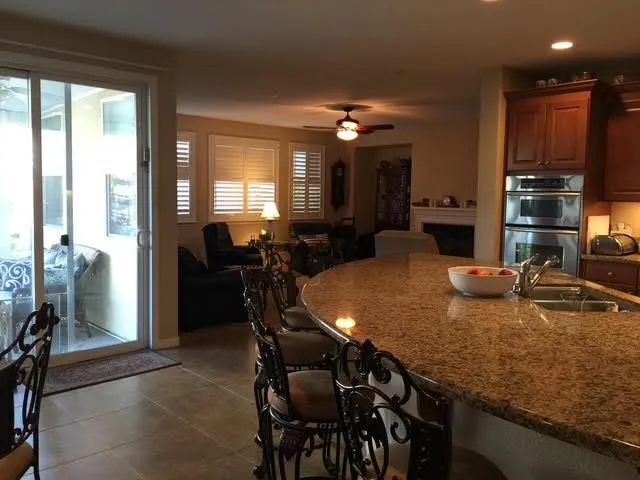 a dining room with furniture and window