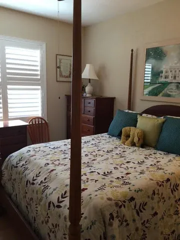a bathroom with a sink a mirror and a shower
