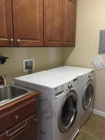a bedroom with a bed window and couch