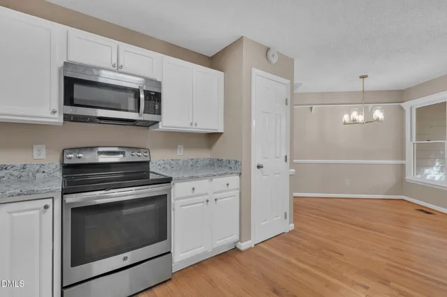 a view of a livingroom with wooden floor