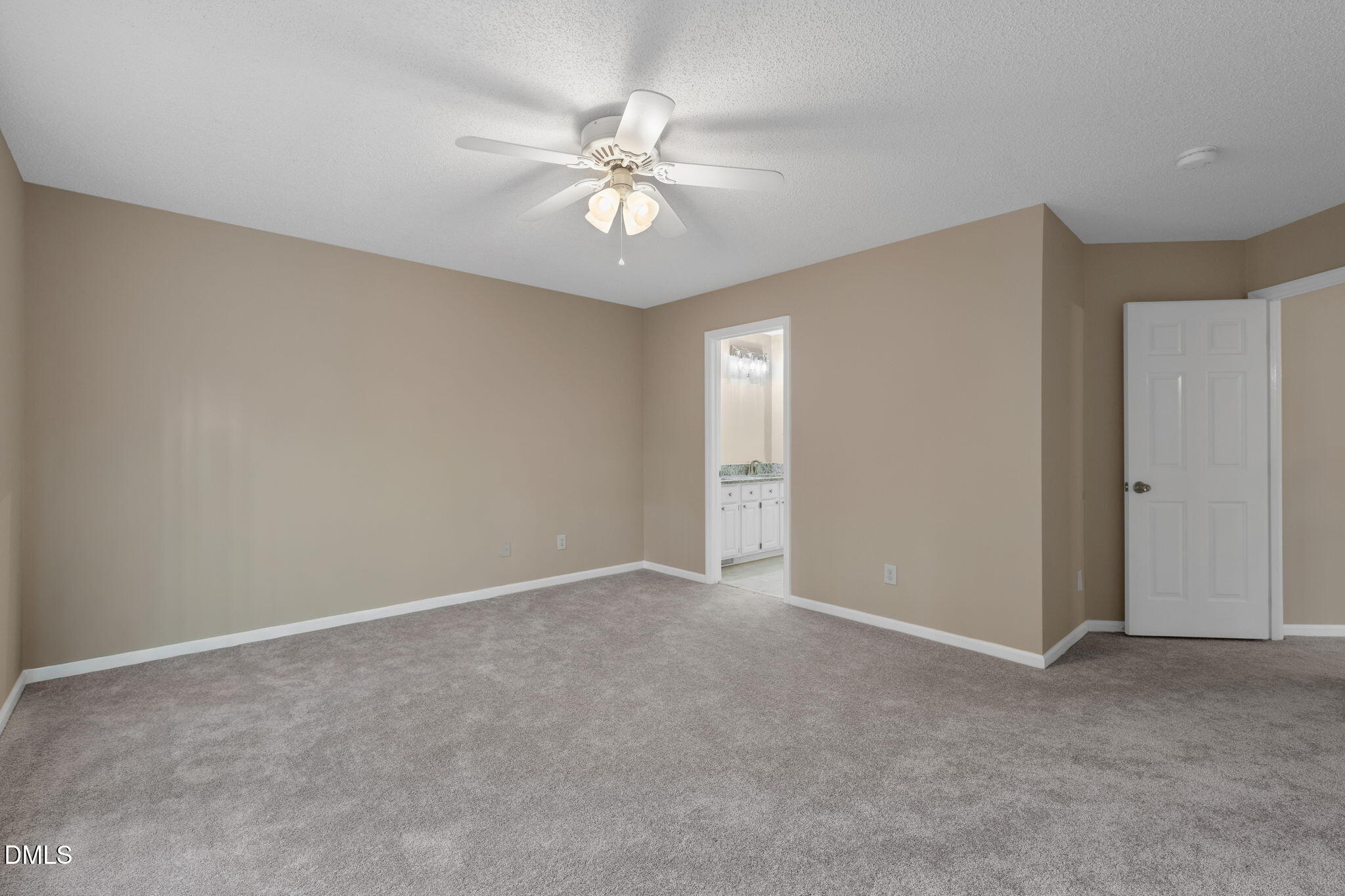 42 Renwick Court Raleigh, NC 27615 - Photo 19 of 58 a view of an empty room with a chandelier fan