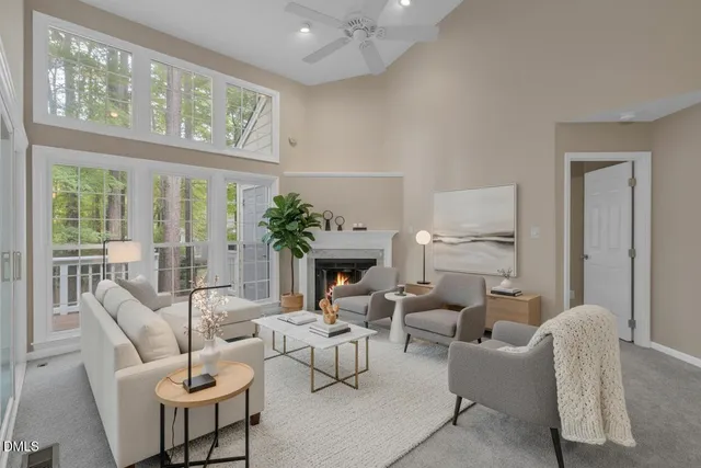 a view of an empty room with a window and fireplace