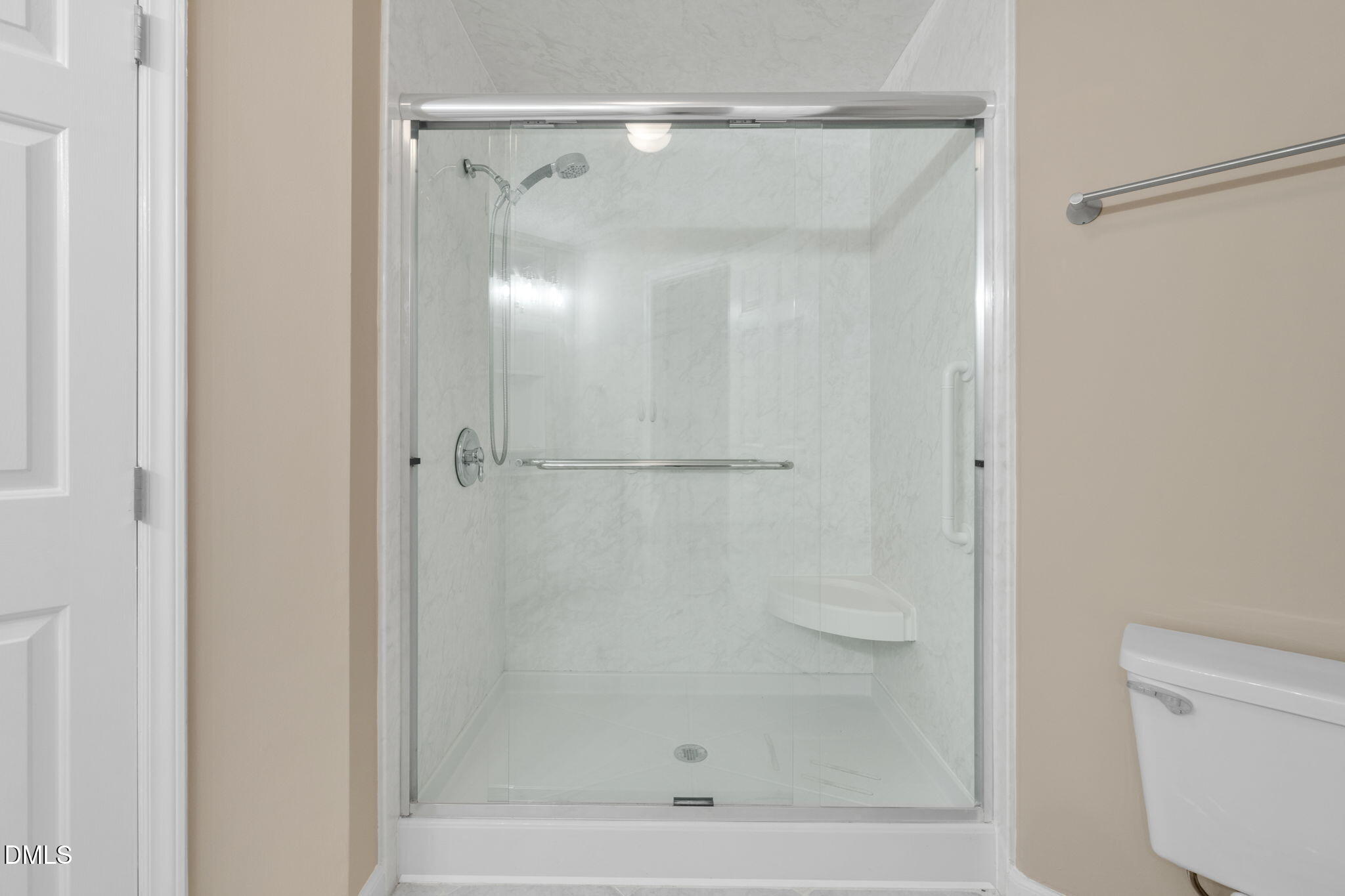 42 Renwick Court Raleigh, NC 27615 - Photo 21 of 58 a bathroom with a glass shower door