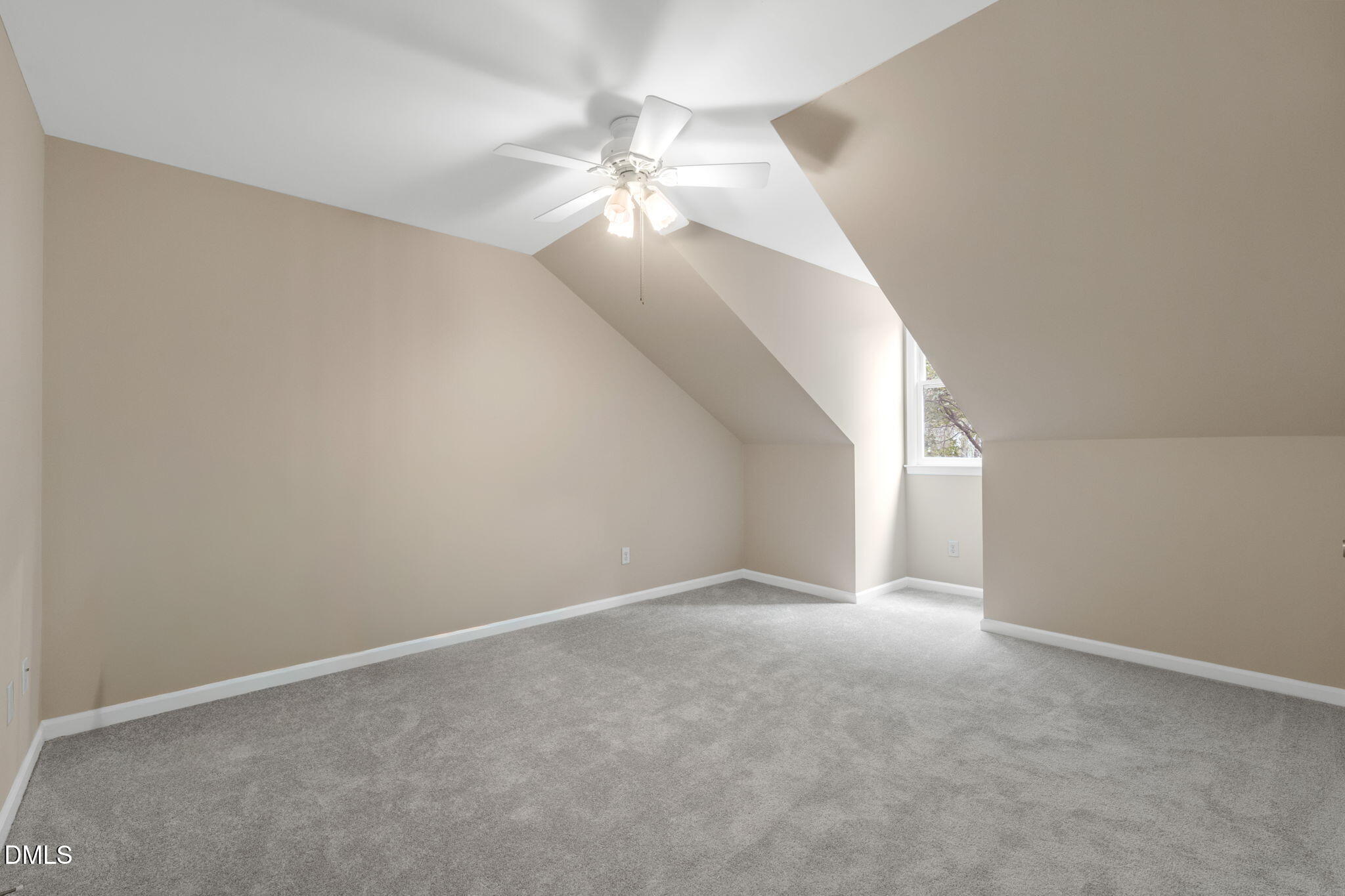 42 Renwick Court Raleigh, NC 27615 - Photo 36 of 58 a view of an empty room with a chandelier fan