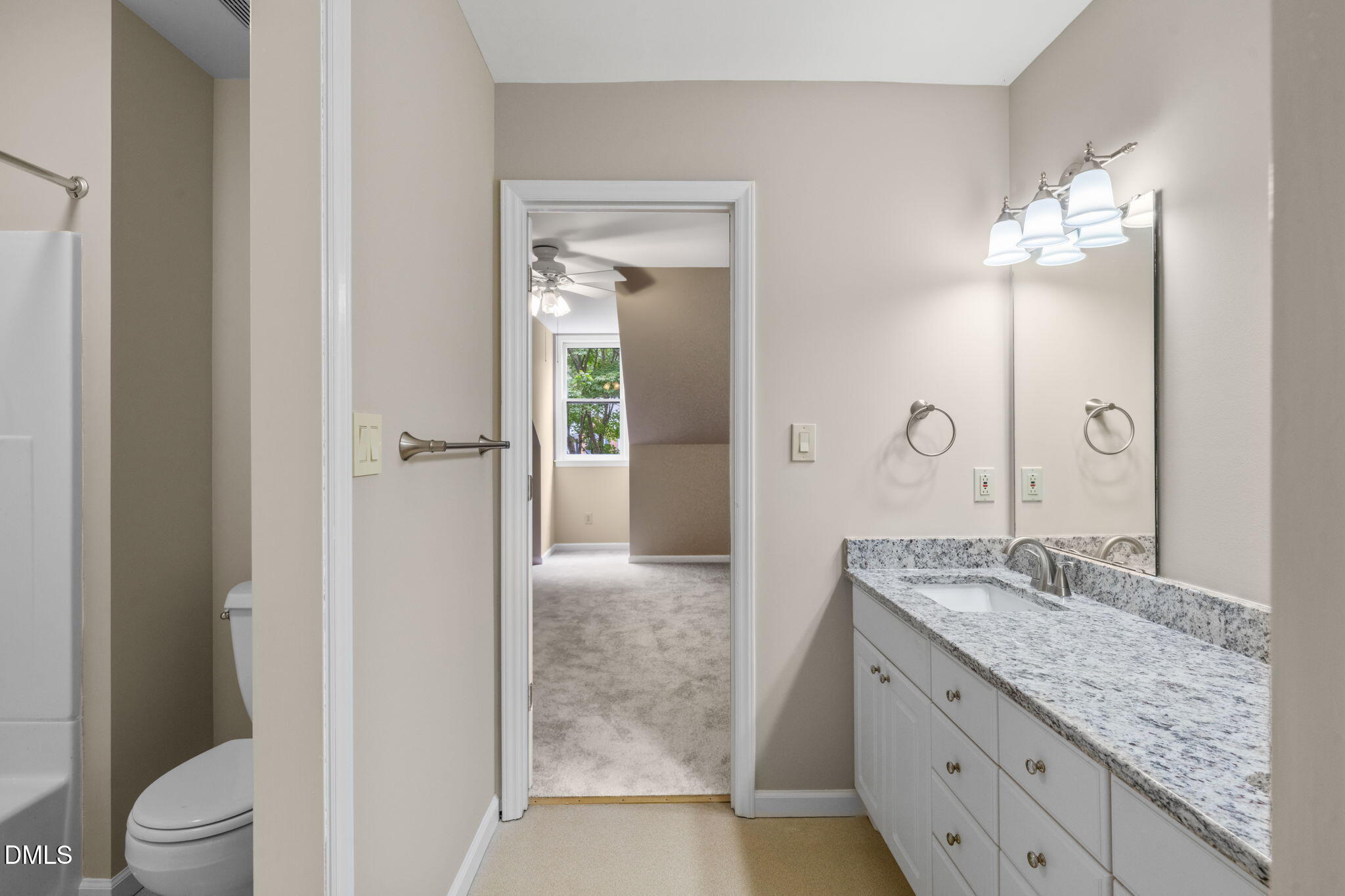 42 Renwick Court Raleigh, NC 27615 - Photo 40 of 58 a bathroom with a granite countertop sink a toilet and shower