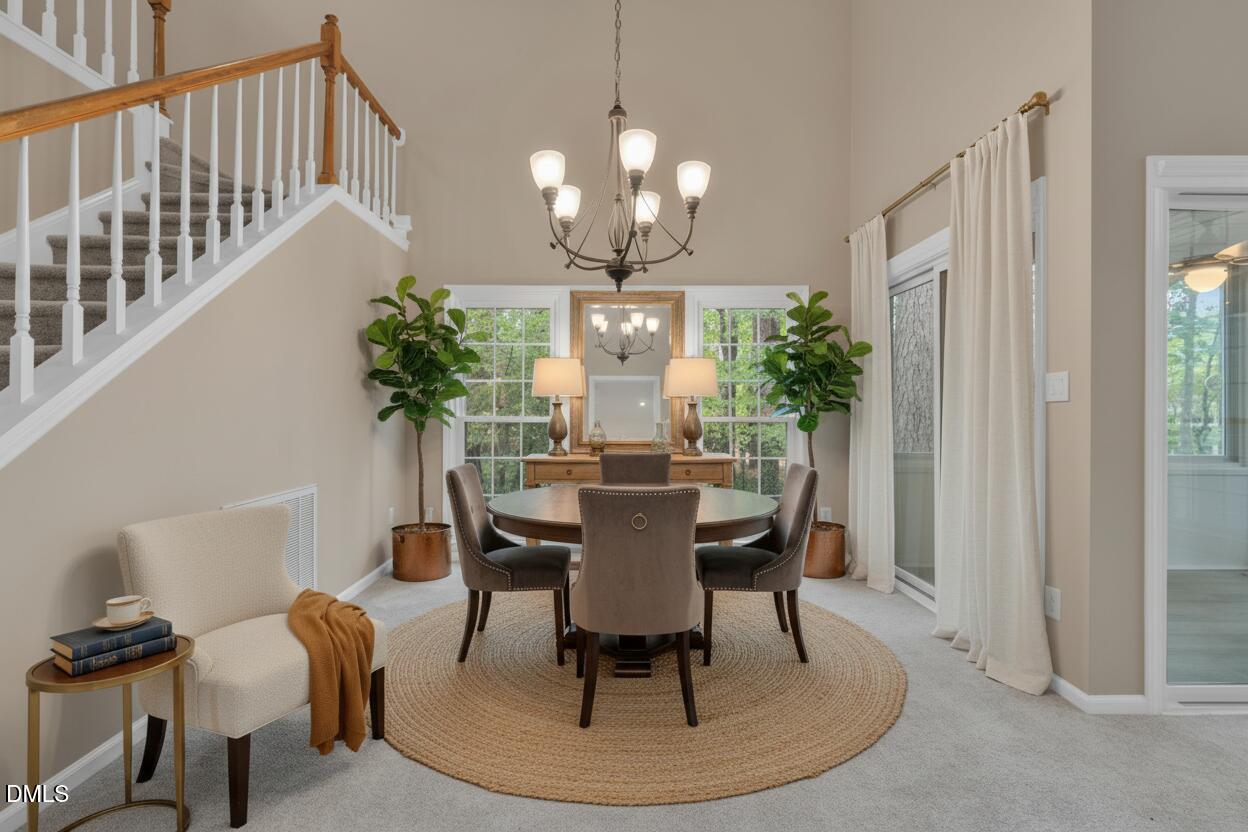 42 Renwick Court Raleigh, NC 27615 - Photo 7 of 58 a view of a dining room with furniture and wooden floor
