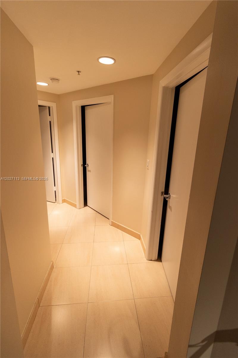 7275 Southwest 90th Way, Unit 213 Miami, FL 33156 - Photo 21 of 31 a view of hallway with stairs