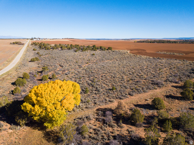 412 South Eastland Road Monticello, UT 84535 - Photo 3 of 14 Aerial view of property and surrounding area featuring rural landscape and a desert landscape