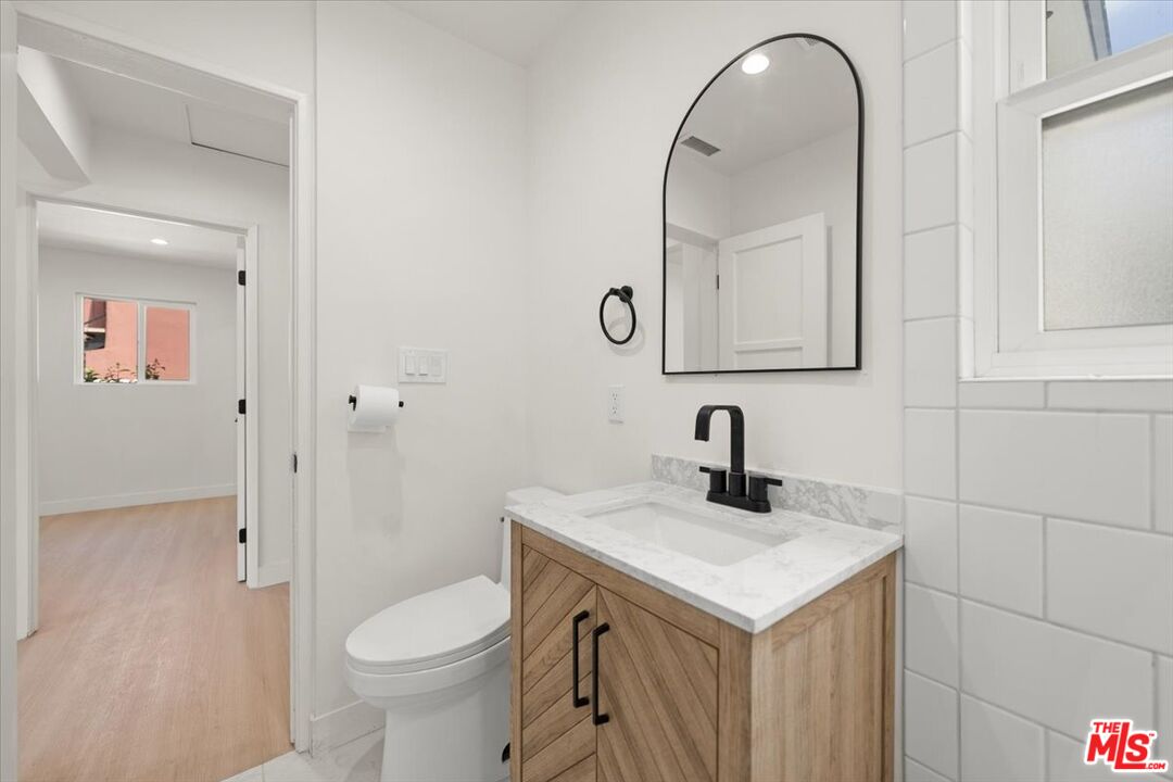 702 Washington Boulevard Marina del Rey, CA 90292 - Photo 15 of 18 a bathroom with a sink toilet and vanity