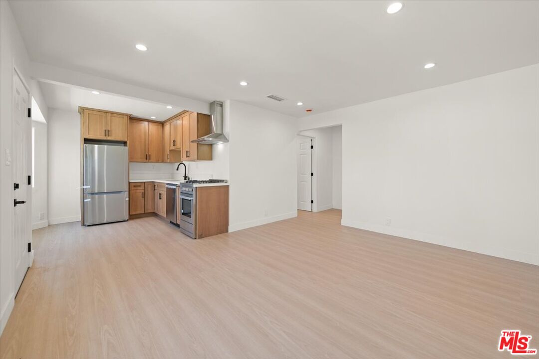 702 Washington Boulevard Marina del Rey, CA 90292 - Photo 5 of 18 a view of a kitchen with wooden floor