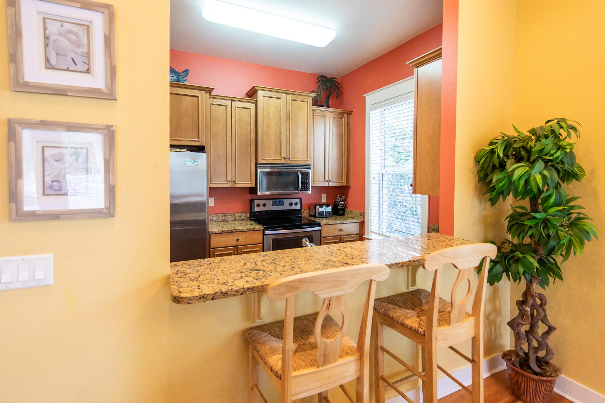 49 Endless Summer Way East Inlet Beach, FL 32461 - Photo 11 of 40 a kitchen with stainless steel appliances granite countertop a stove a sink and a refrigerator