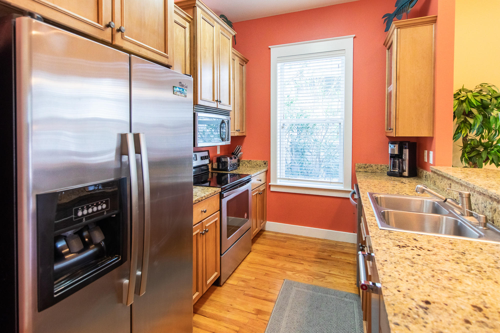 49 Endless Summer Way East Inlet Beach, FL 32461 - Photo 12 of 40 a kitchen with stainless steel appliances granite countertop a refrigerator and a sink