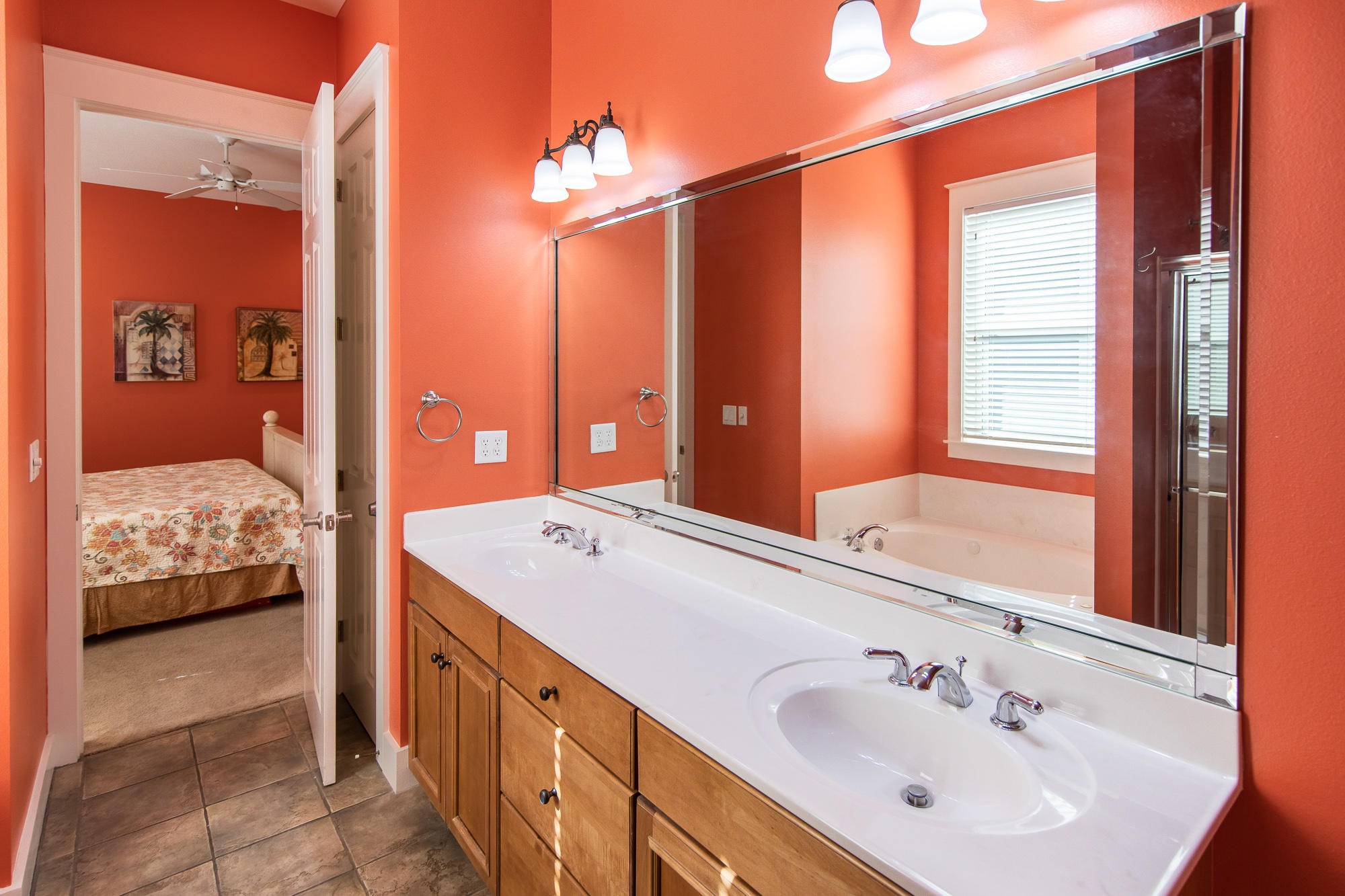 49 Endless Summer Way East Inlet Beach, FL 32461 - Photo 16 of 40 a spacious bathroom with a double vanity sink and a mirror