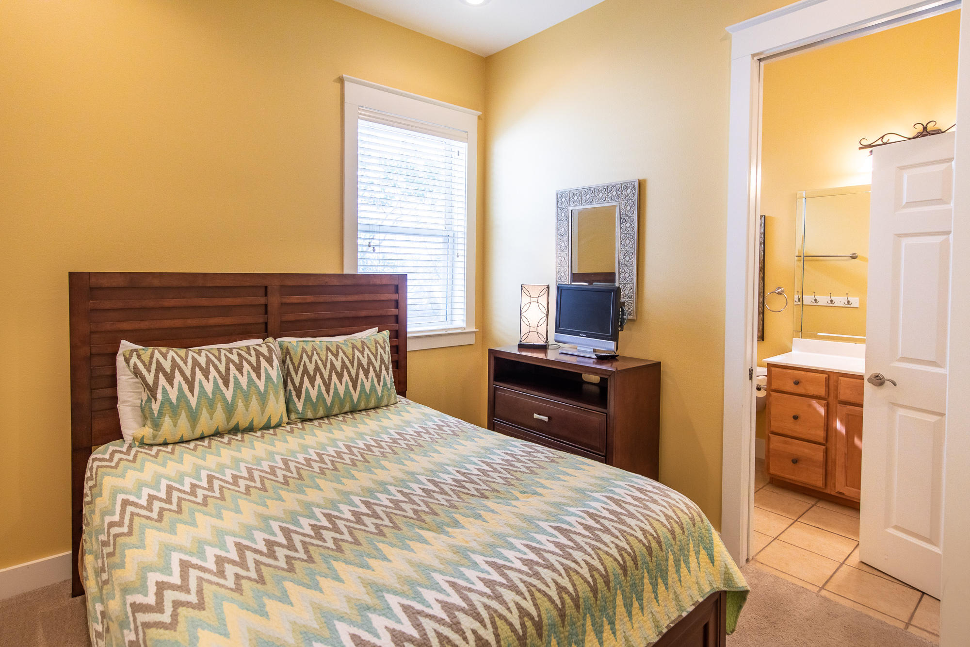 49 Endless Summer Way East Inlet Beach, FL 32461 - Photo 19 of 40 a bedroom with a bed and wooden floor
