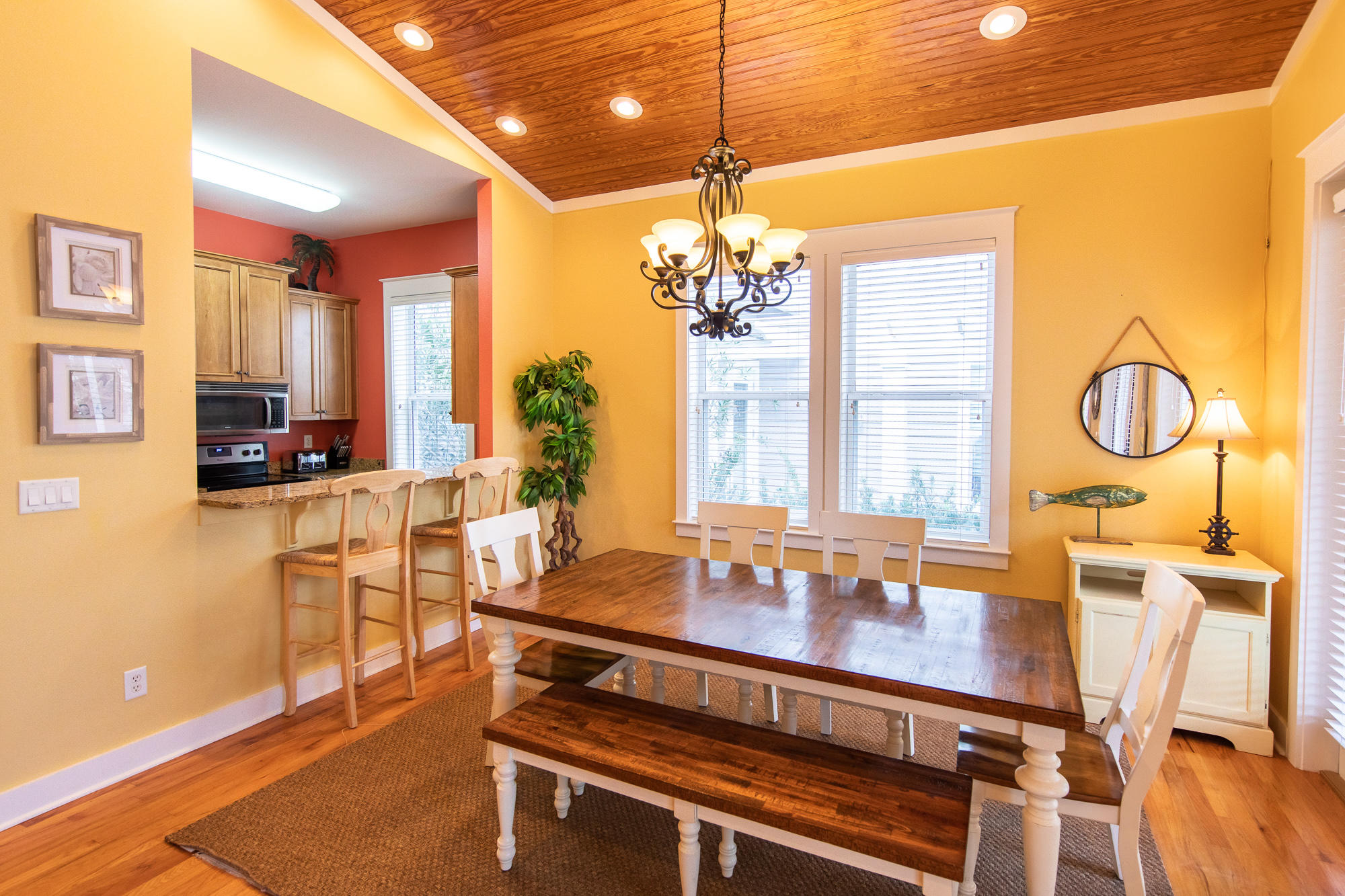 49 Endless Summer Way East Inlet Beach, FL 32461 - Photo 8 of 40 a dining room with furniture a chandelier a mirror and a table