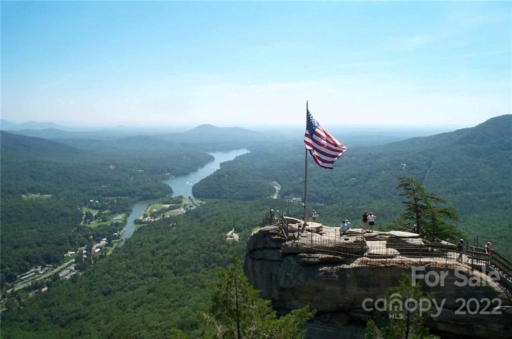 0 Chasewood Drive, Unit 8 Rutherfordton, NC 28139 - Photo 13 of 16 a backyard of a house with table and chairs